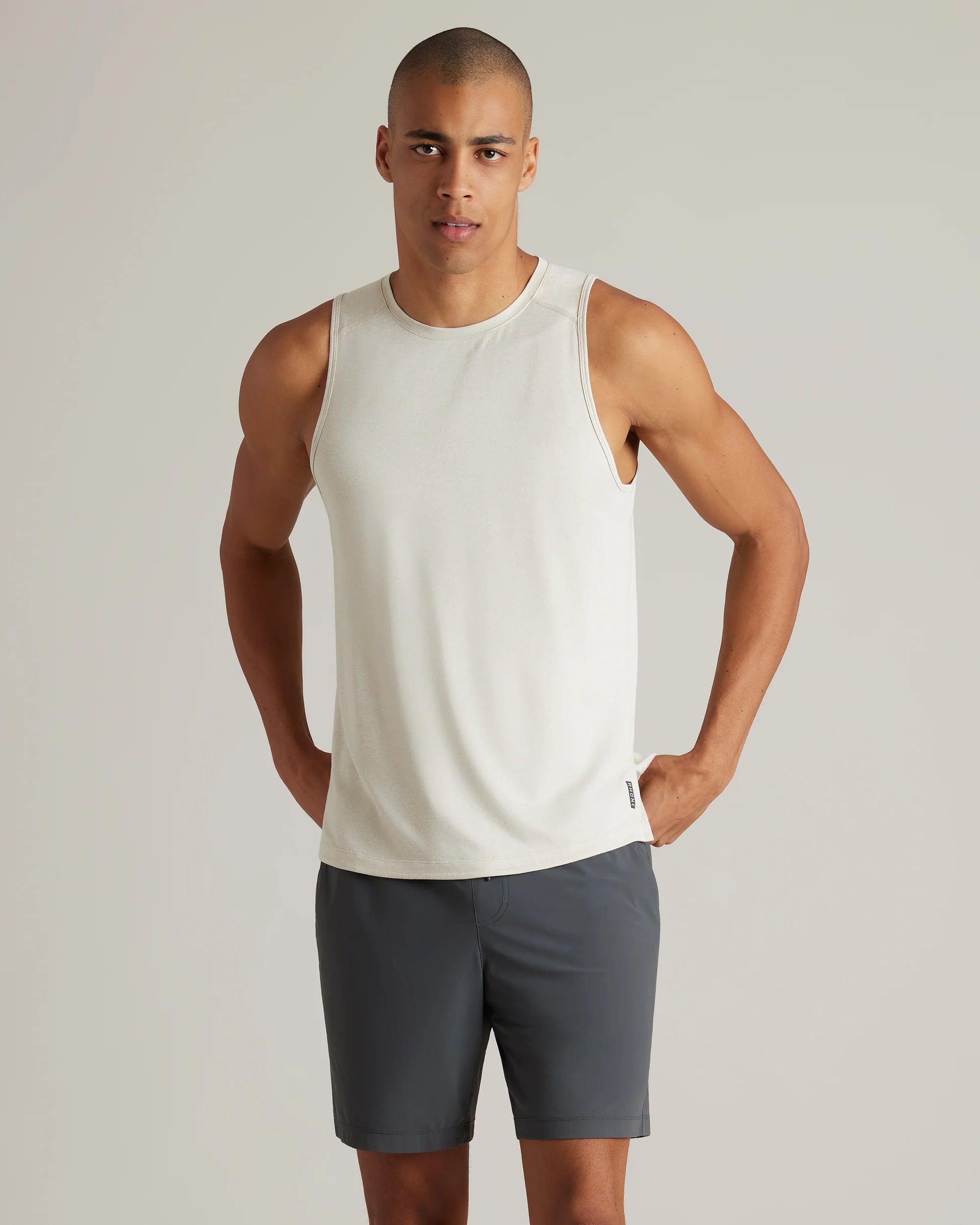 Men's fashionable active t-shirt-Rhone Men's Atmosphere Tank Top - Sandstone/White Heather